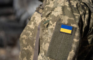 Ukrainian flag on a military uniform war soldier