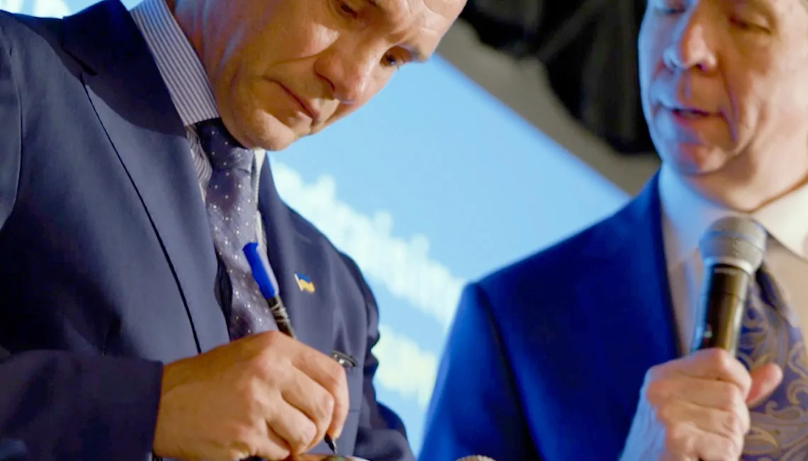 International soccer legend Andriy Shevchenko, President of the Ukrainian Association of Football singing an ball for G.Miller